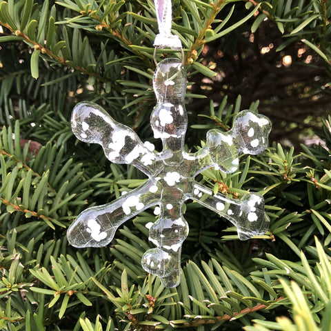 Fused glass snowflake with snowy accents on tree