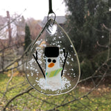 Teardrop Snowman Sun Catcher Ornament with Green Scarf on Window