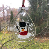 Teardrop Snowman Sun Catcher Ornament with Red Scarf on Window