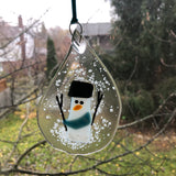 Teardrop Snowman Sun Catcher Ornament with Blue Scarf on Window