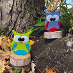 Fused glass owl collection on birch.